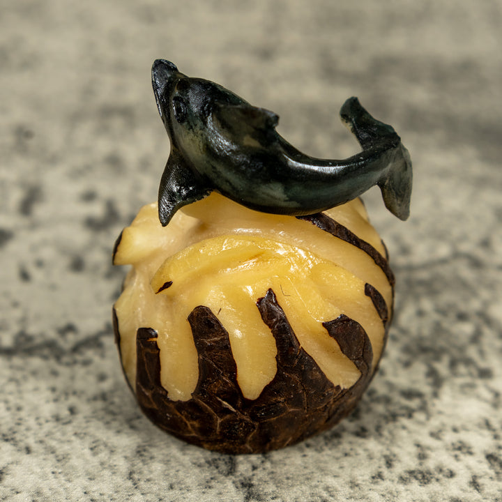 Black And Gray Dolphin Riding Waves Tagua Carving