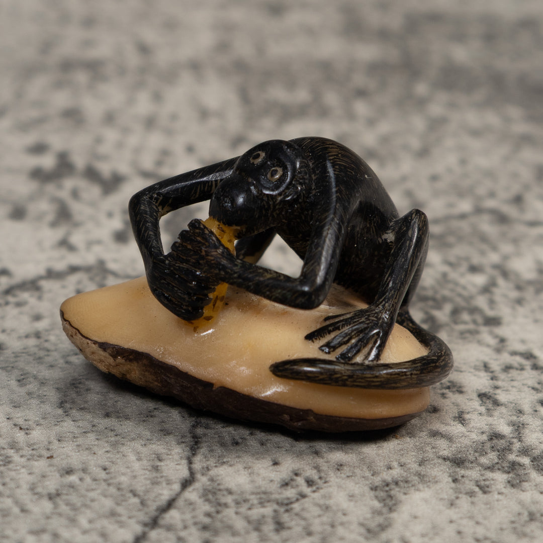 Signed Howler Monkey Eating Banana Tagua Carving