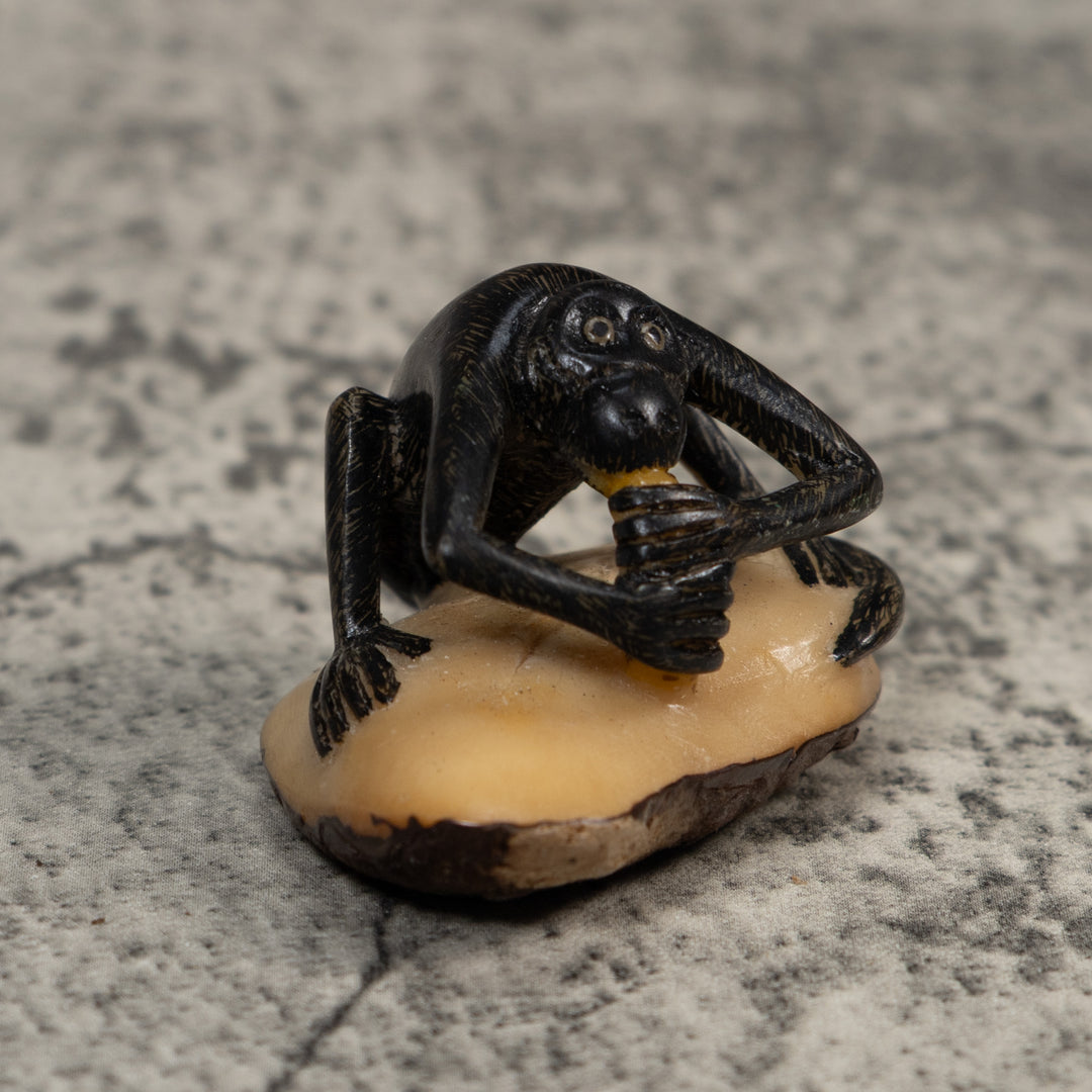 Signed Howler Monkey Eating Banana Tagua Carving
