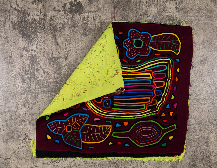 Hand stitched Guna mola from Guna Yala Panama, tiny triangles scattered across the background
