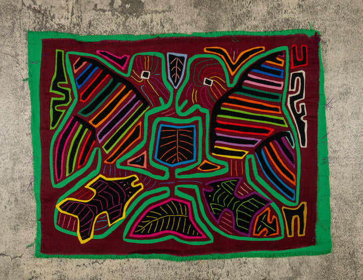 Panama mola panel, two striped wing birds above two fish in green outline on maroon, hand stitched reverse applique