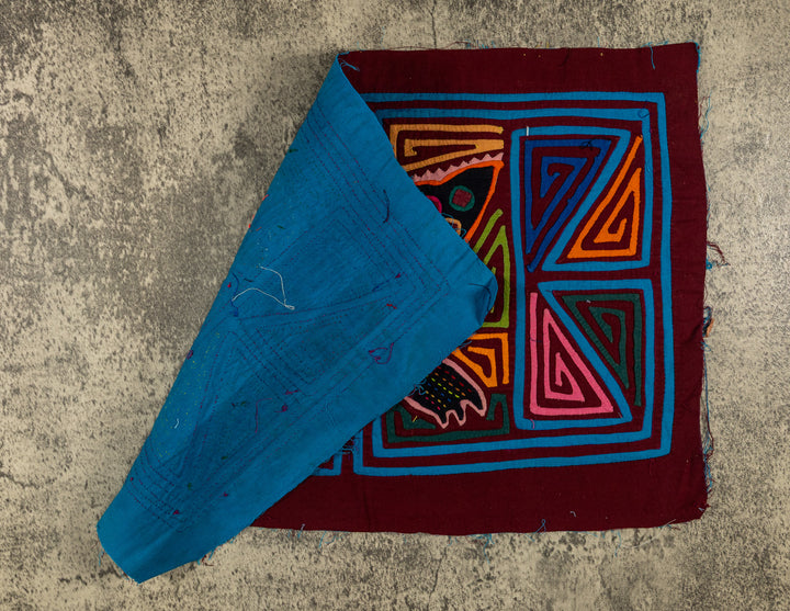 Hand stitched Guna mola from Guna Yala Panama, triangle spirals on both sides