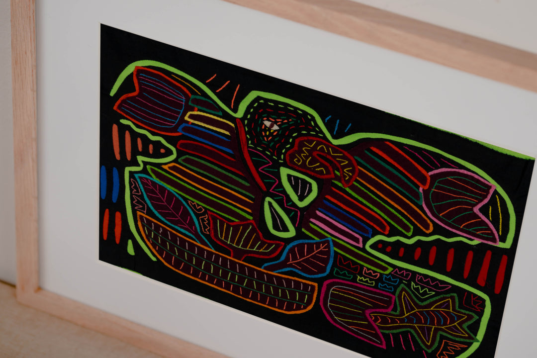 Hand stitched Guna mola from Guna Yala Panama, macaw with embroidered eye and colored border