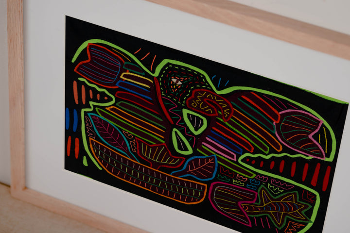 Hand stitched Guna mola from Guna Yala Panama, macaw with embroidered eye and colored border