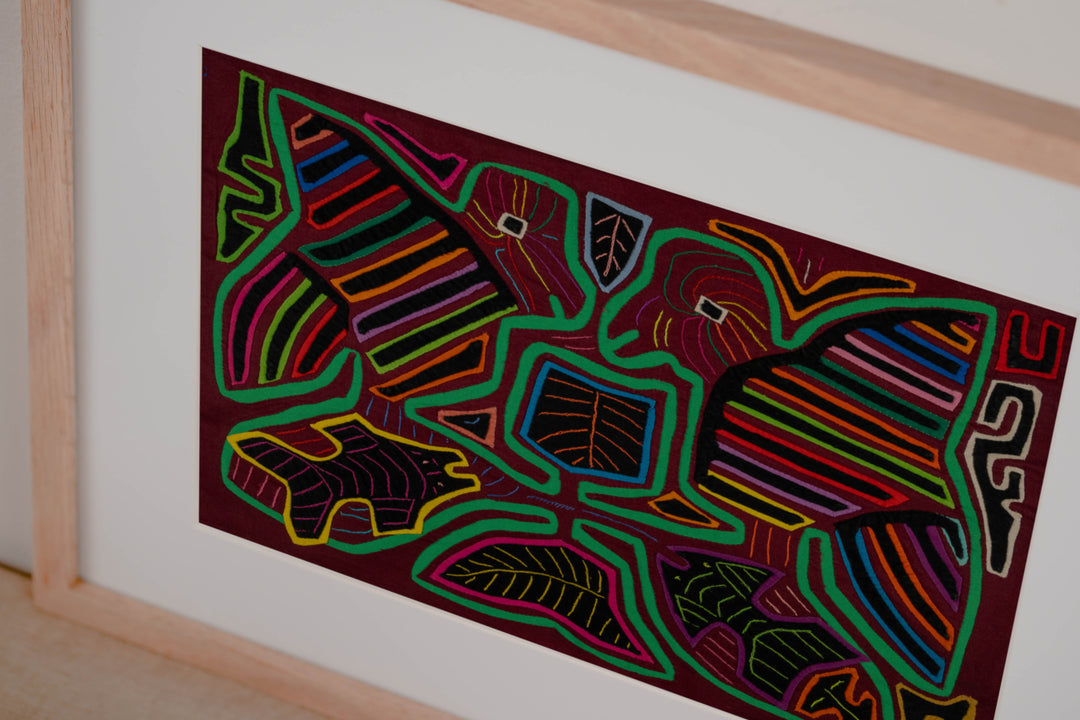 Hand stitched Guna mola from Guna Yala Panama, fish swimming along the lower edge below the birds