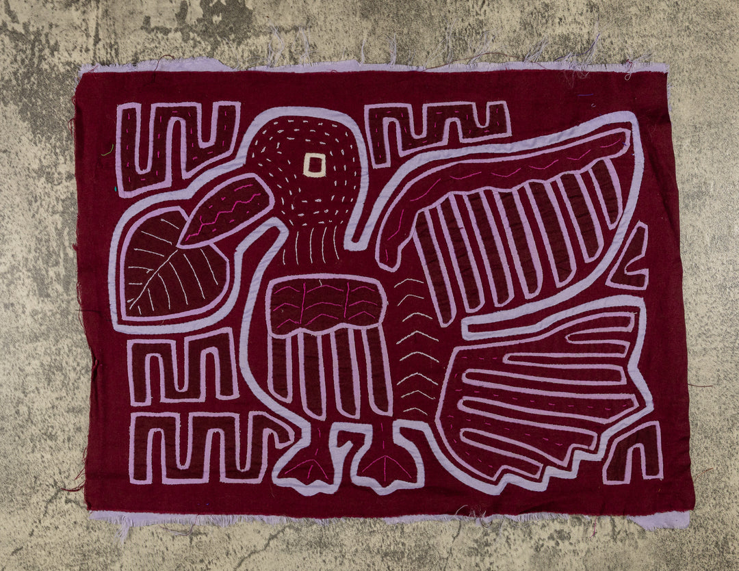 Panama mola panel, duck bird with wings opened wide in lavender outline on maroon, hand stitched reverse applique