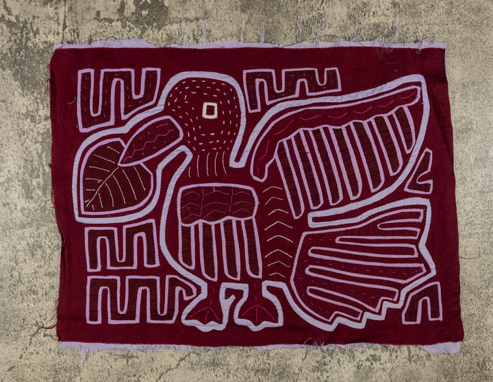Panama mola panel, duck bird with wings opened wide in lavender outline on maroon, hand stitched reverse applique