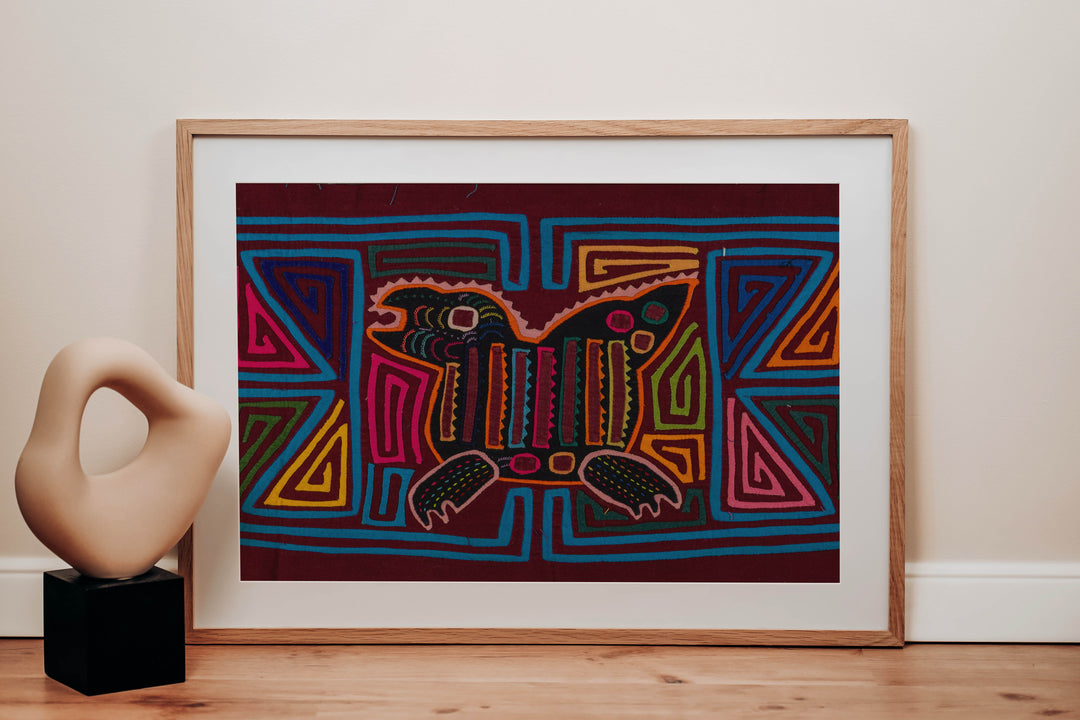 Panama mola panel, crested creature with a striped body and clawed feet in turquoise outline, hand stitched reverse applique