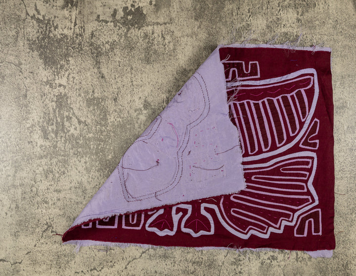 Hand stitched Guna mola from Guna Yala Panama, single leaf stitched beside the outstretched wing