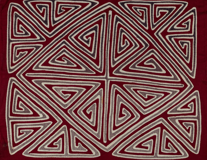 Spiral triangles in a big X mola, hand stitched Guna panel from Panama, 16 by 13.5 inches