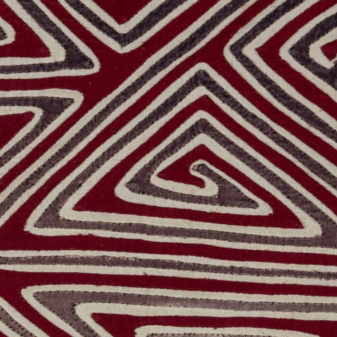 Spiral triangles in a big X mola, hand stitched Guna panel from Panama, 16 by 13.5 inches