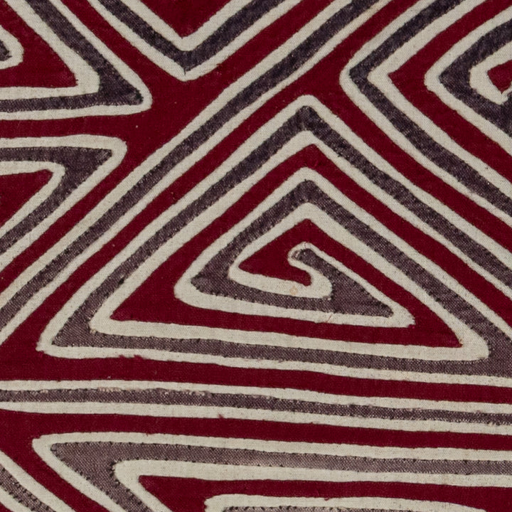 Spiral triangles in a big X mola, hand stitched Guna panel from Panama, 16 by 13.5 inches
