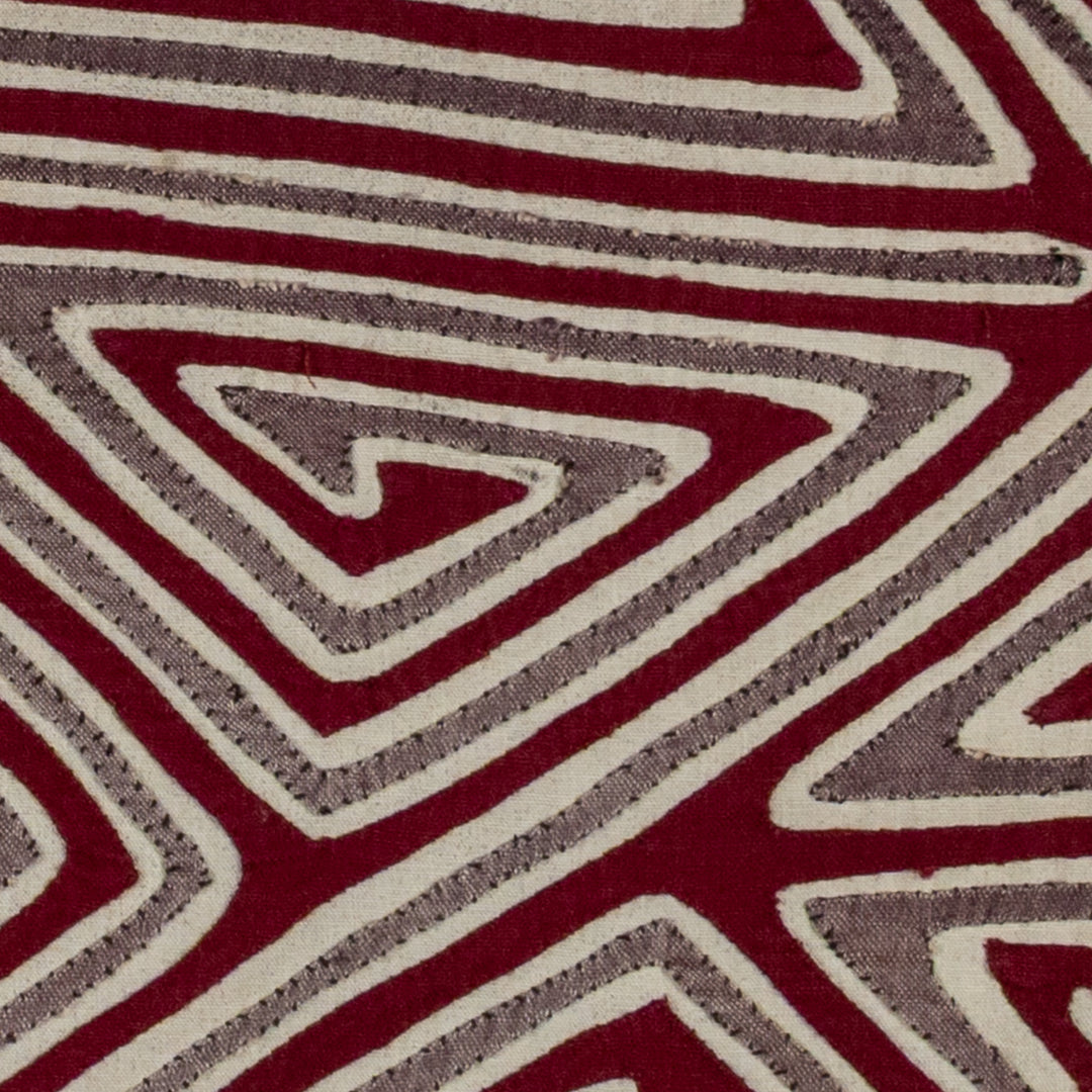 Spiral triangles in a big X mola, hand stitched Guna panel from Panama, 16 by 13.5 inches