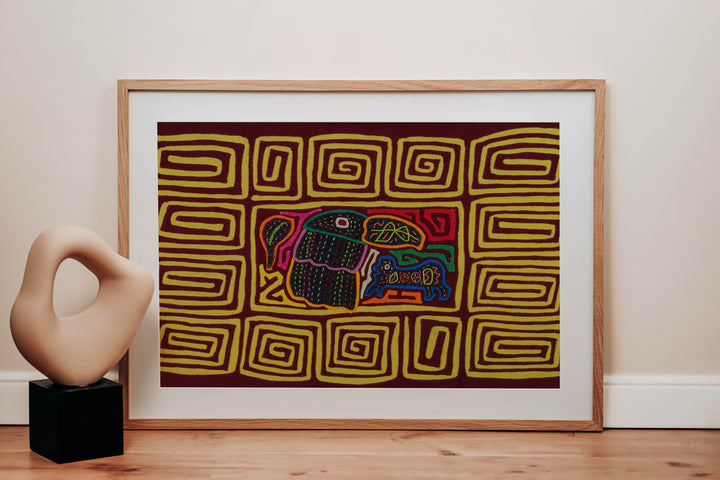 Panama mola panel, toucan beside a small blue critter inside a yellow spiral border, hand stitched reverse applique