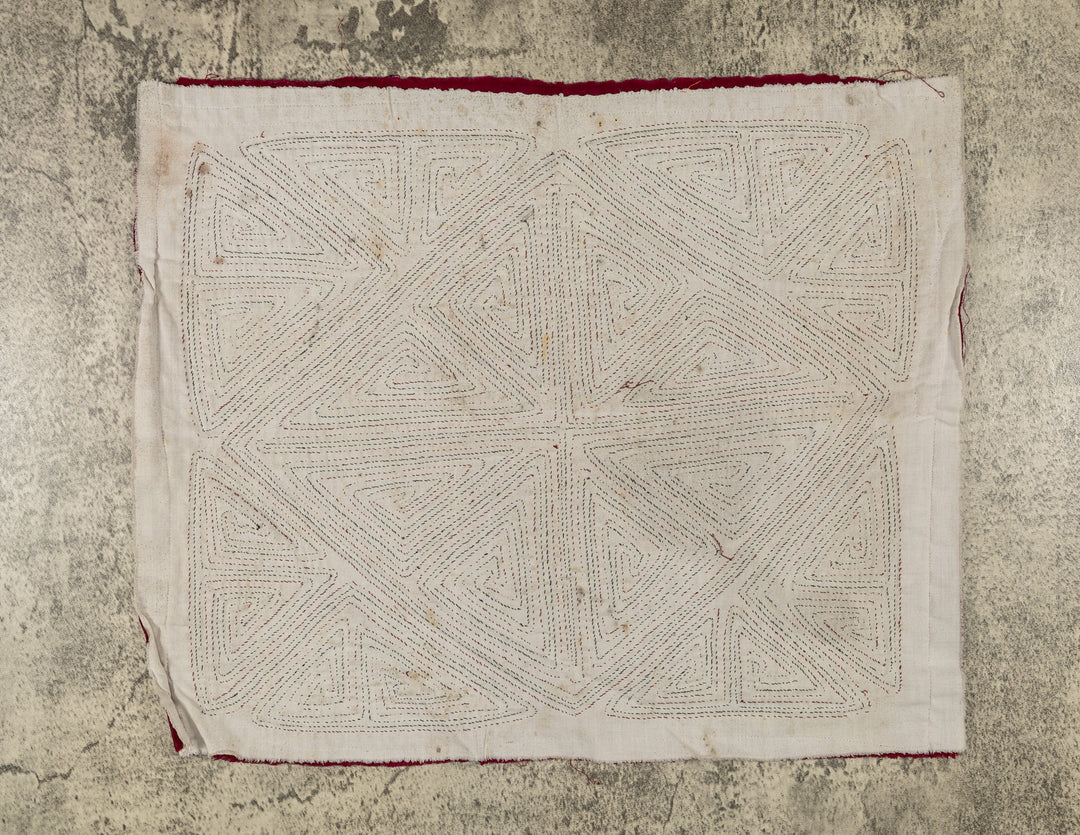 Spiral triangles in a big X mola, hand stitched Guna panel from Panama, 16 by 13.5 inches