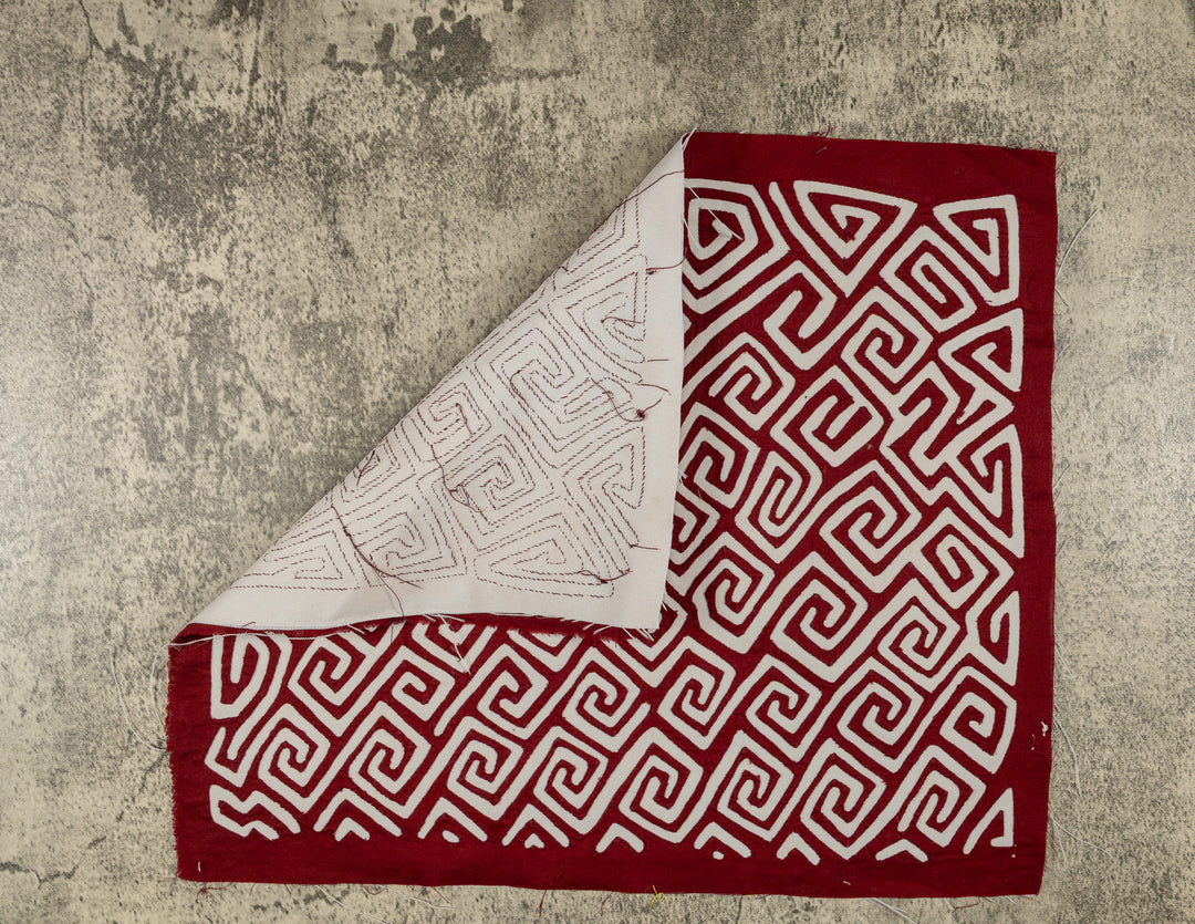 Hand stitched Guna mola from Guna Yala Panama, sharp right angle turns folding back at each corner