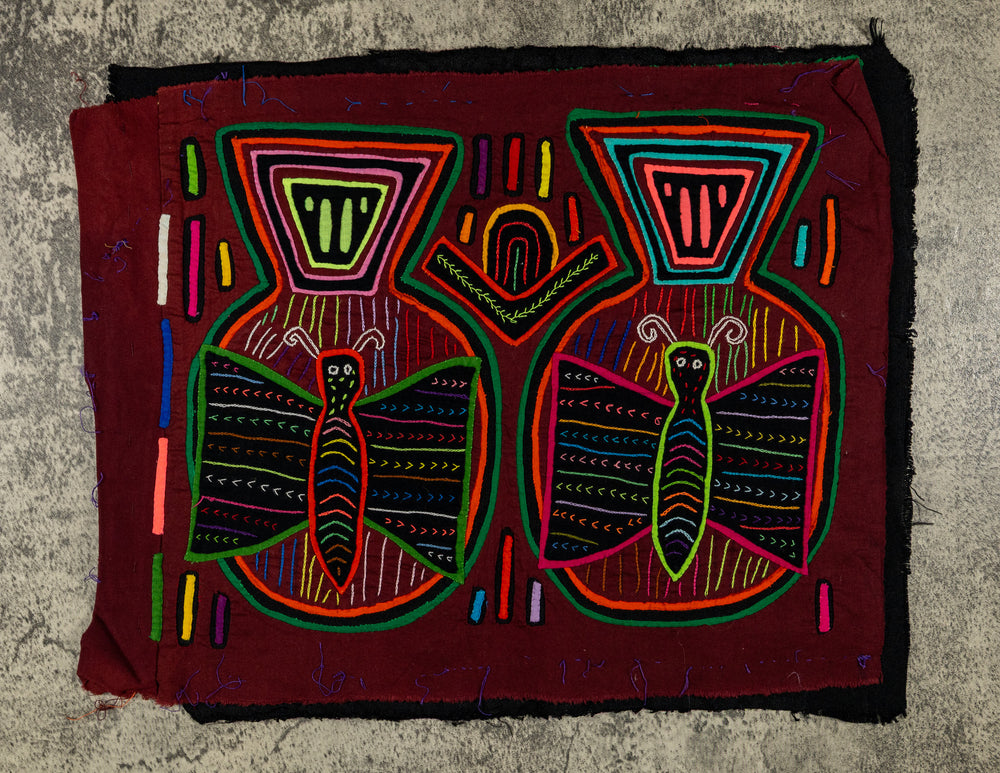 Panama mola panel, two striped butterflies in jar shapes with patterned lids on maroon, hand stitched reverse applique