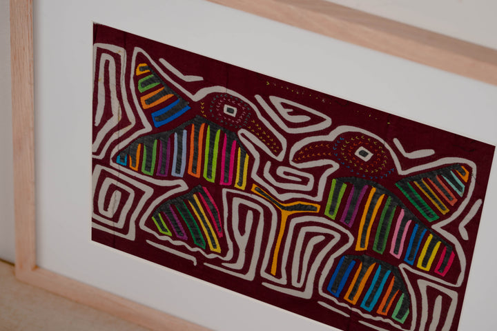 Maroon And White Two Bird In flight Mola
