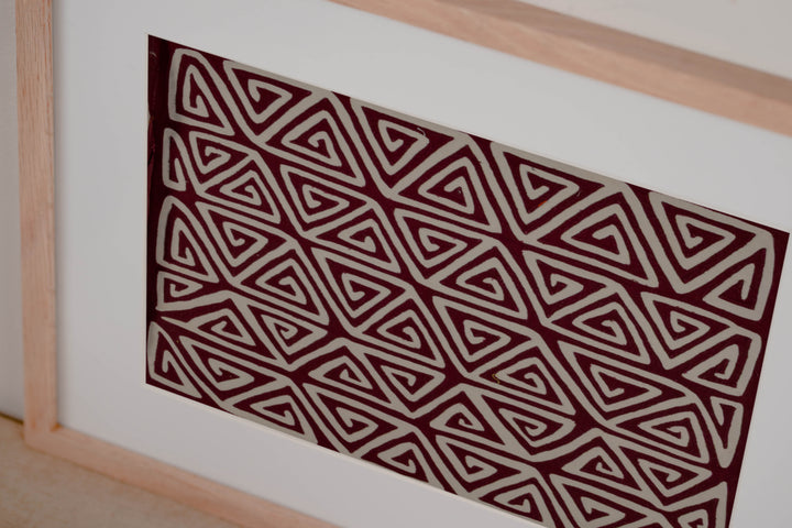 Hand stitched Guna mola from Guna Yala Panama, neat repeat of pointed spirals lined up row after row