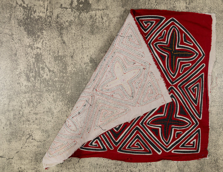 Hand stitched Guna mola from Guna Yala Panama, zigzag edges giving each snowflake a frosty sparkle