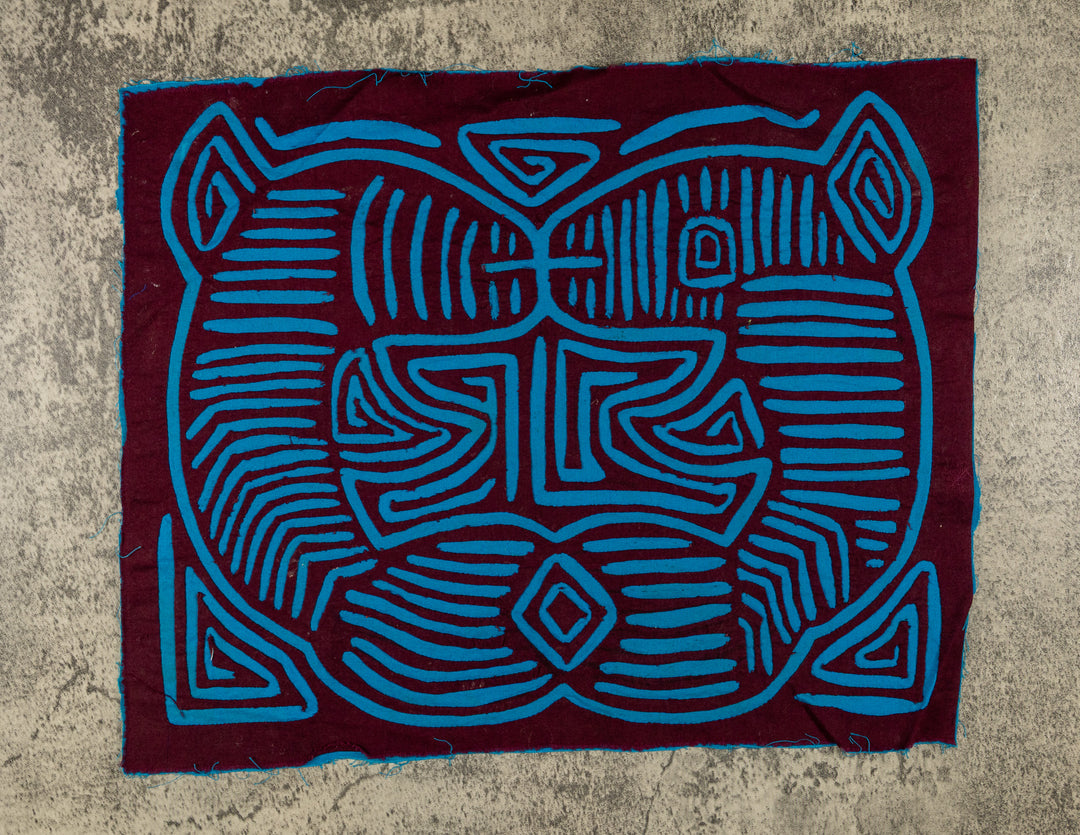 Panama mola panel, turquoise stripes, points and eyes forming an illusion on maroon, hand stitched reverse applique