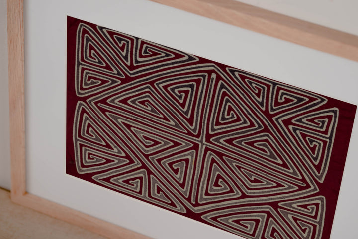 Hand stitched Guna mola from Guna Yala Panama, diamond shape set at the crossing point of the X