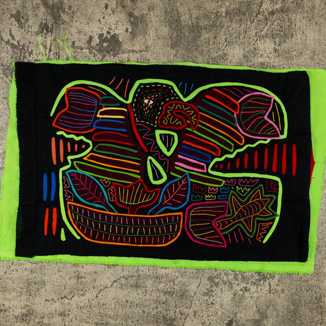 Panama mola panel, green macaw with rainbow wing bands on black, hand stitched reverse applique