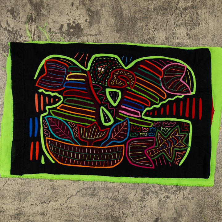 Panama mola panel, green macaw with rainbow wing bands on black, hand stitched reverse applique
