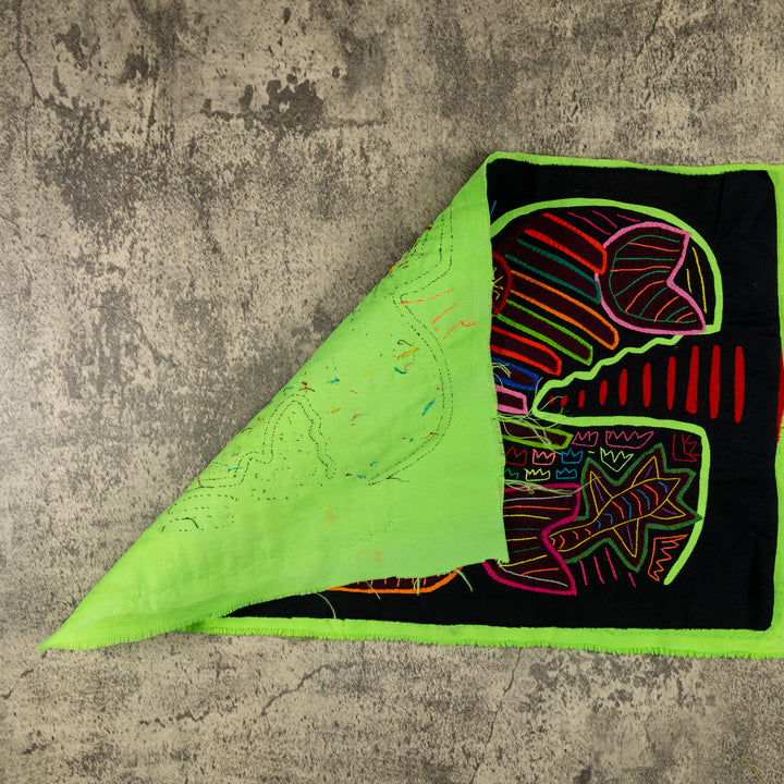 Hand stitched Guna mola from Guna Yala Panama, macaw with embroidered eye and colored border
