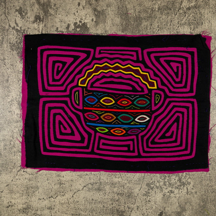 Panama mola panel, basket piled with eggs in magenta, pink and red on black, hand stitched reverse applique
