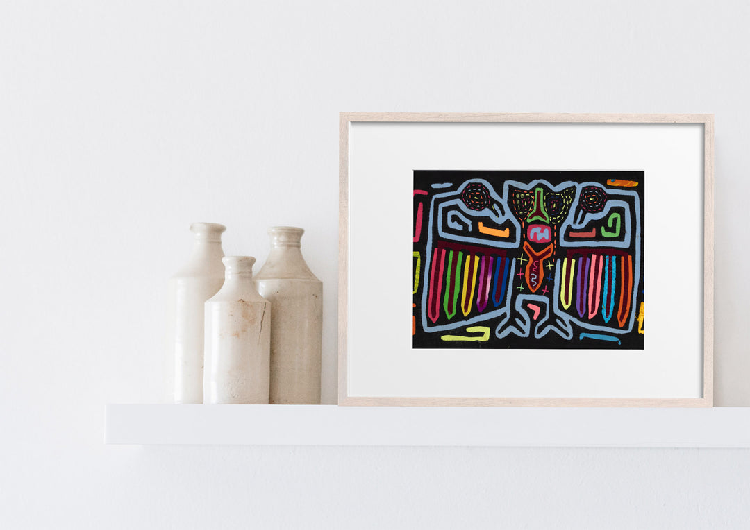 Panama mola panel, central figure with rainbow wings on black, hand stitched reverse applique