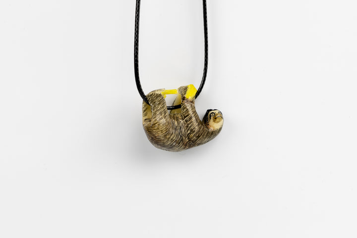 Grey sloth tagua with plants