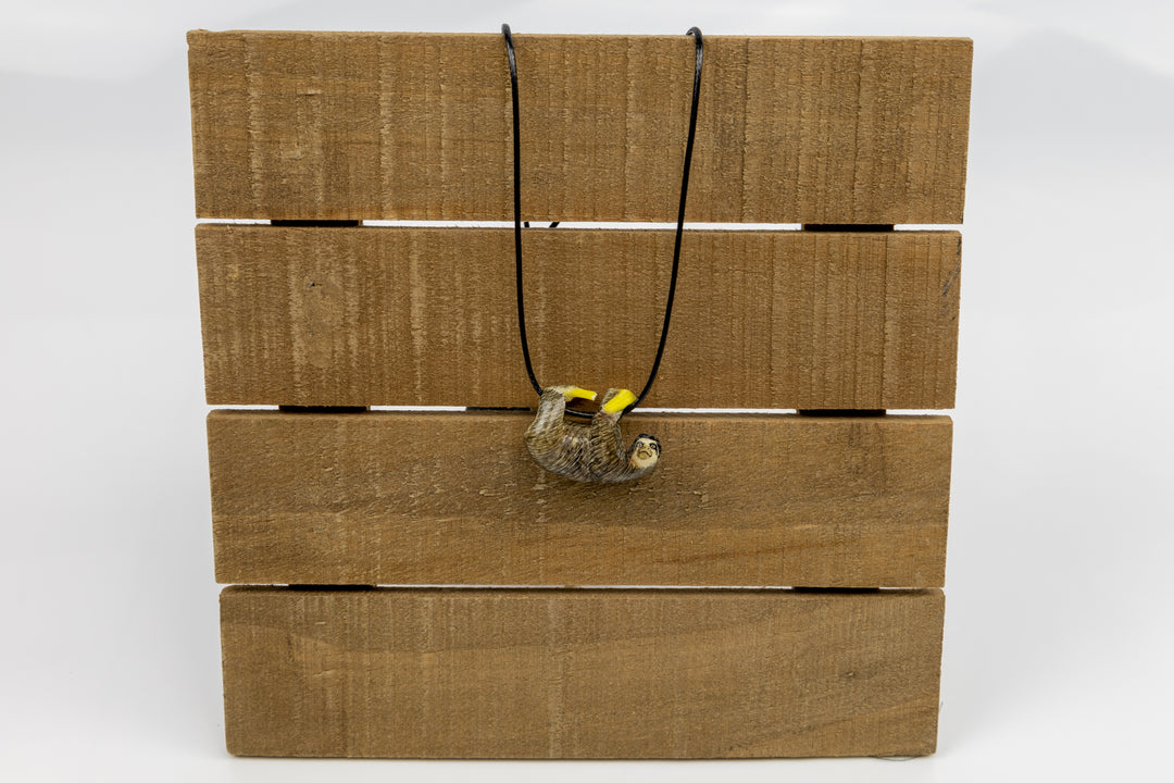 Grey sloth tagua on wood platform