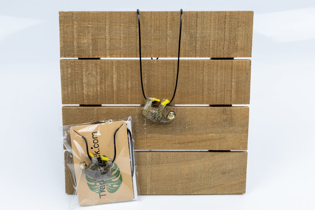 Sloth tagua necklace in packaging