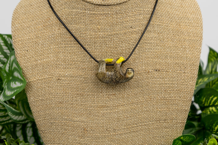 Grey sloth tagua necklace with plants