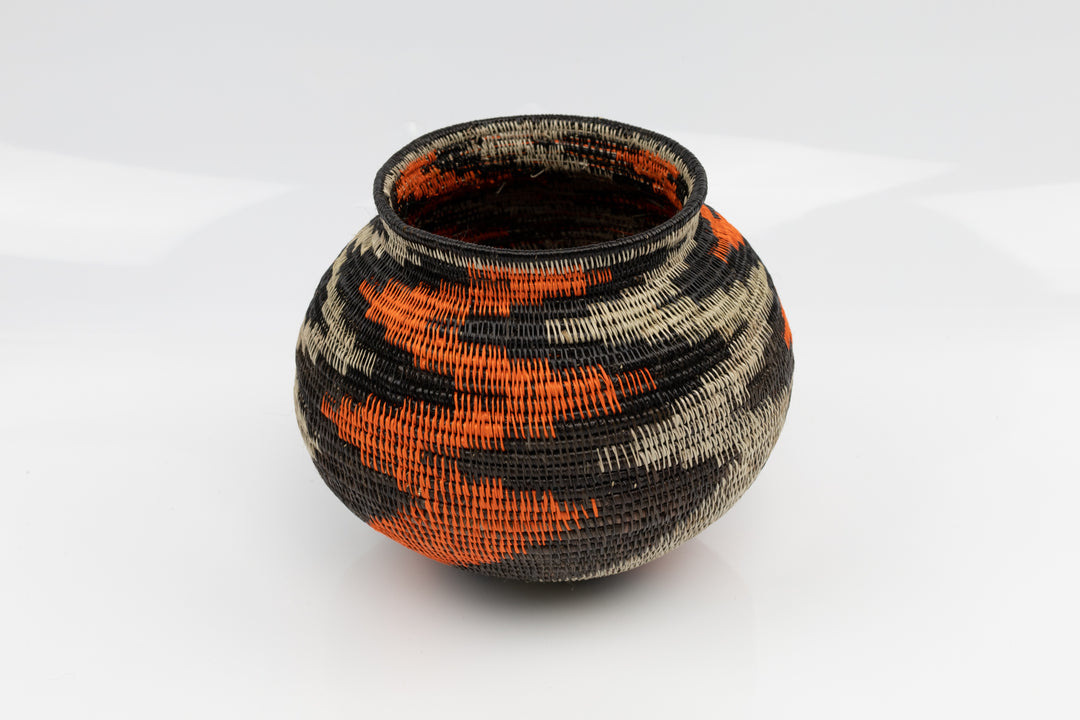 Panama Hand woven black and orange basket. palm fiber. natural dyes.