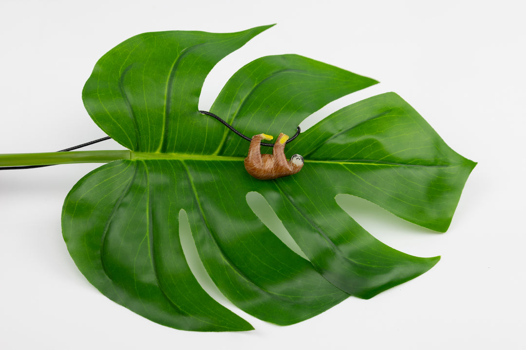 Sloth tagua pendant on leaf