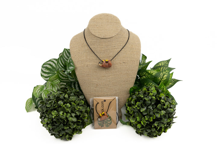 Grey sloth tagua on wood