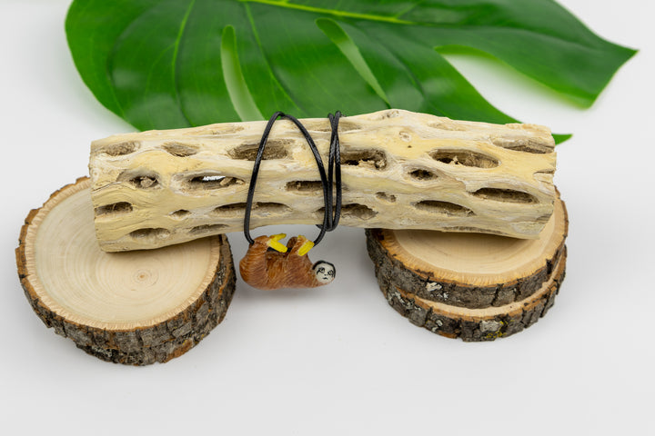 Sloth tagua on bust display, orange with yellow markings