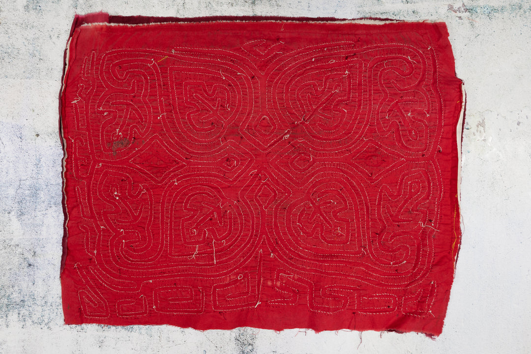 Hand stitched Guna mola from Guna Yala Panama, red and white lines with a key border