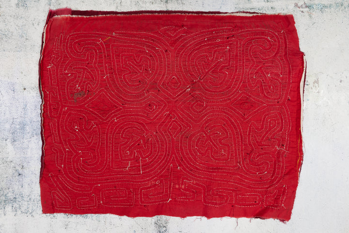 Hand stitched Guna mola from Guna Yala Panama, red and white lines with a key border