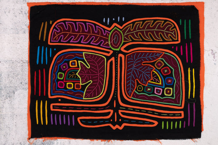 Panama mola panel, orange outlined fronds and veined leaves on black, hand stitched reverse applique