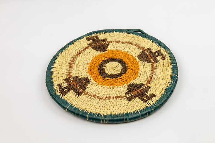 Hand woven plate basket from Panama. blue, gold, brown and white colors. Wall decoration. Indigenous artists Panama.