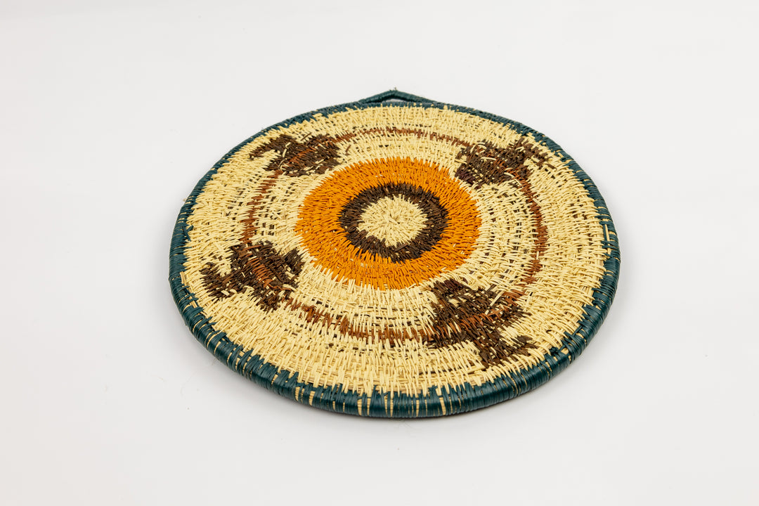 Hand woven plate basket from Panama. blue, gold, brown and white colors. Wall decoration. Indigenous artists Panama.