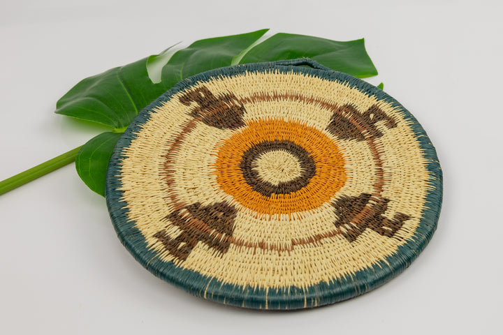 Hand woven plate basket from Panama. blue, gold, brown and white colors. Wall decoration. Indigenous artists Panama.