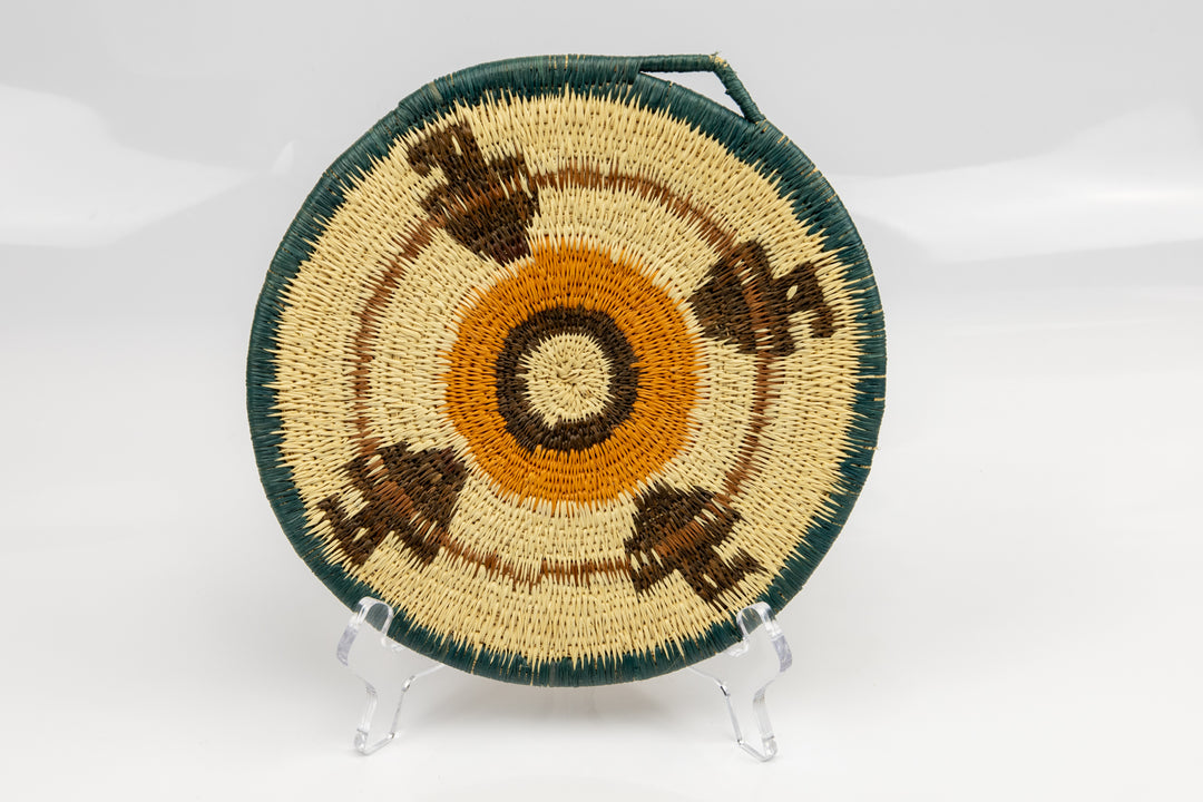 Hand woven plate basket from Panama. blue, gold, brown and white colors. Wall decoration. Indigenous artists Panama.