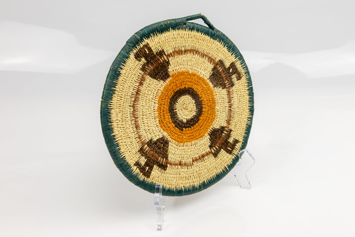 Hand woven plate basket from Panama. blue, gold, brown and white colors. Wall decoration. Indigenous artists Panama.