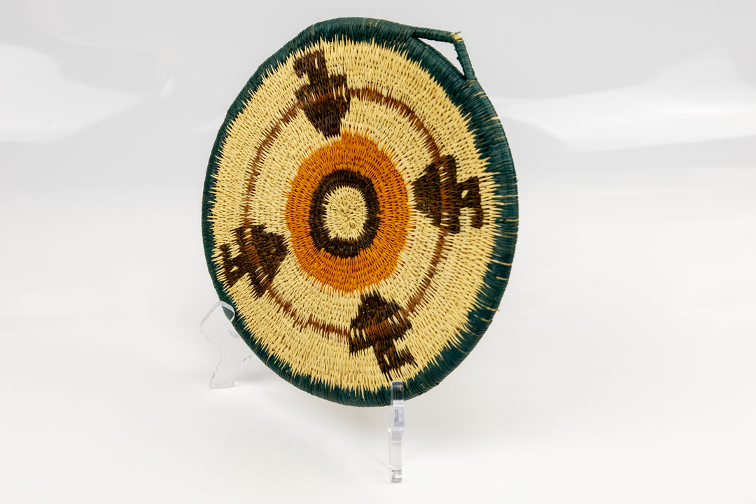 Hand woven plate basket from Panama. blue, gold, brown and white colors. Wall decoration. Indigenous artists Panama.