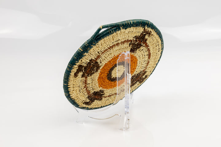 Hand woven plate basket from Panama. blue, gold, brown and white colors. Wall decoration. Indigenous artists Panama.