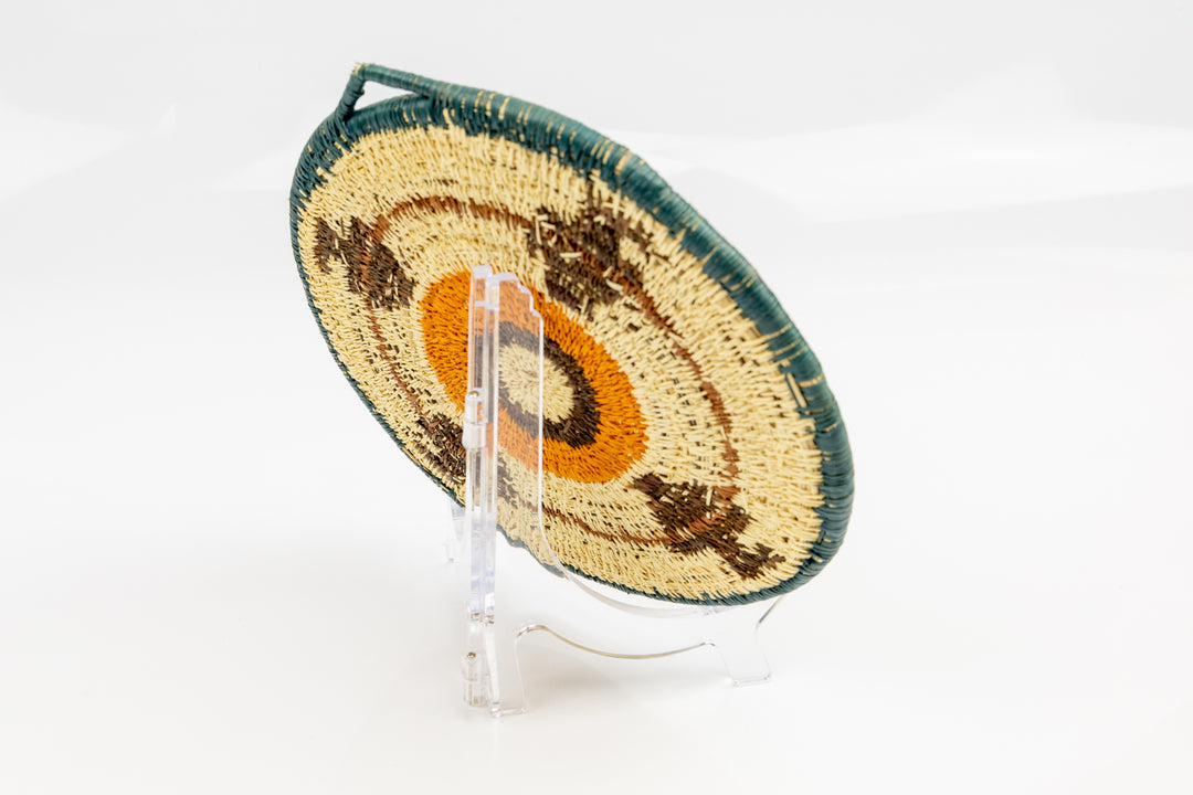 Hand woven plate basket from Panama. blue, gold, brown and white colors. Wall decoration. Indigenous artists Panama.